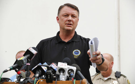The Latest: Suspect worked at farm tied to Republican farmer